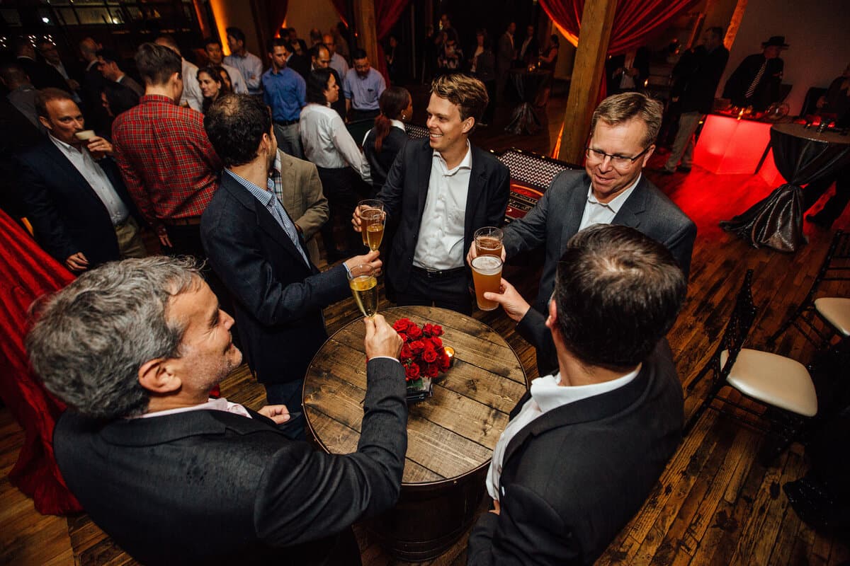 Men cheering over whiskey barrel at Terminus 330