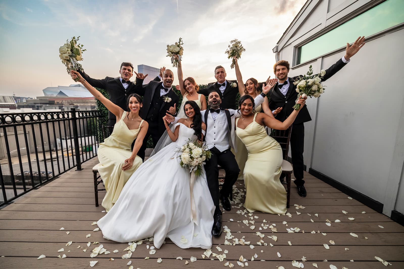 Wedding party cheering on the Rooftop Terrace near Mercedes-Benz Stadium
