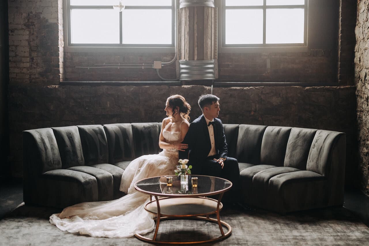 Bride and groom in cellar back to back