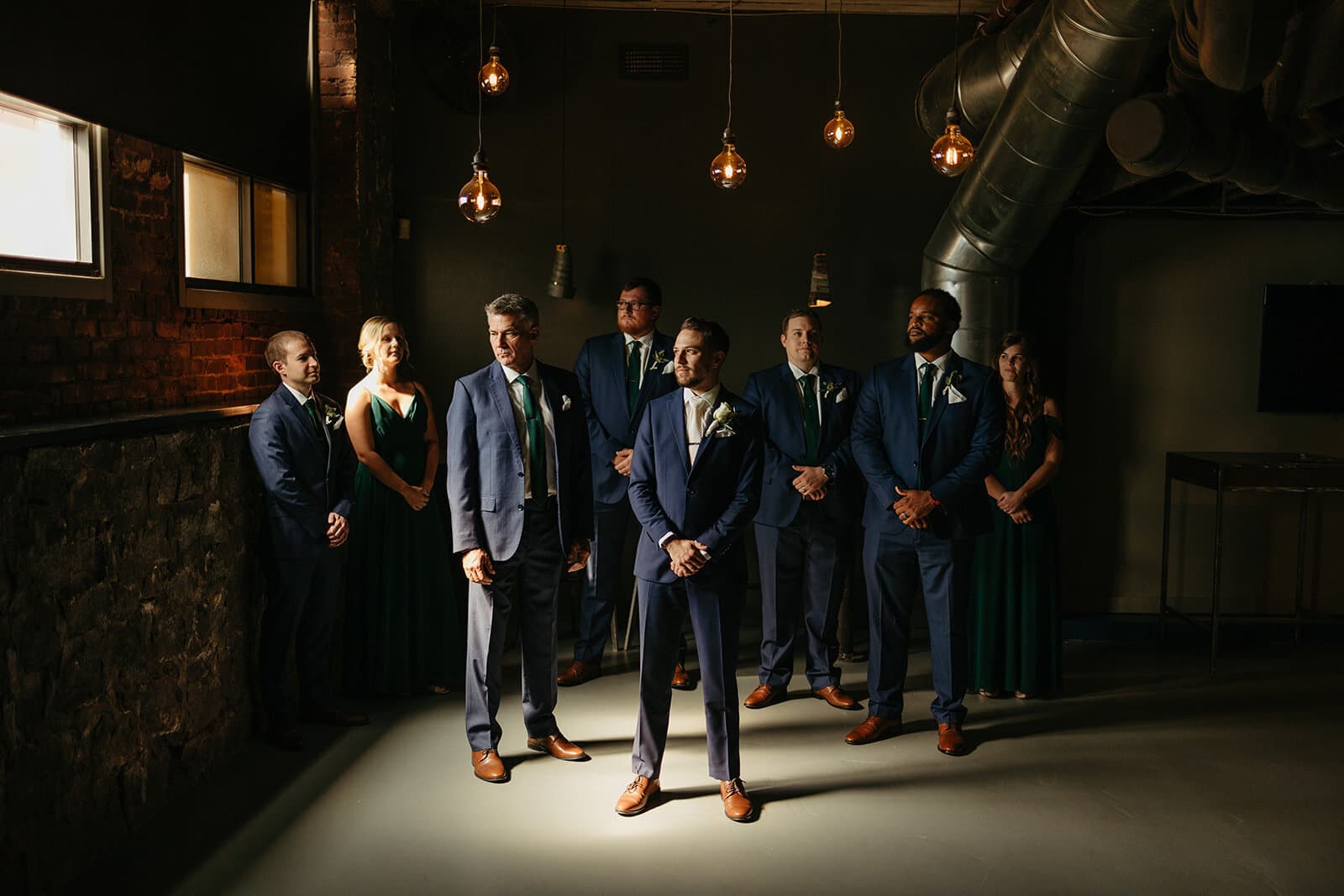 Group posing for photo in the Cellar