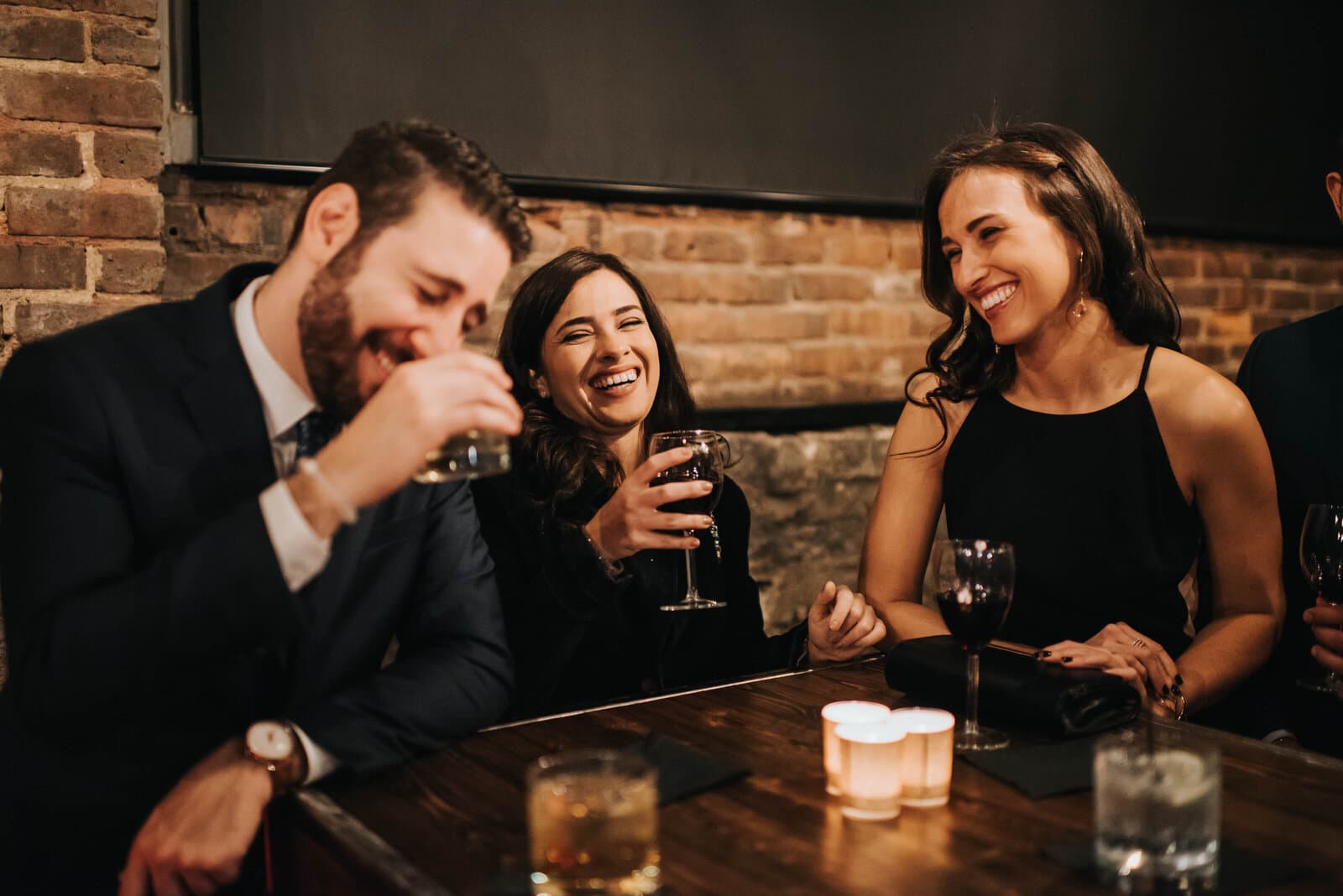 People laughing at an event in the Cellar