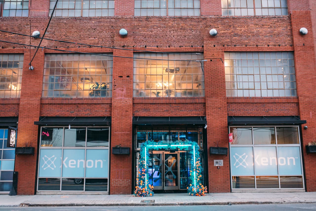 Terminus 330 brick facade with corporate signage and floral entry arch