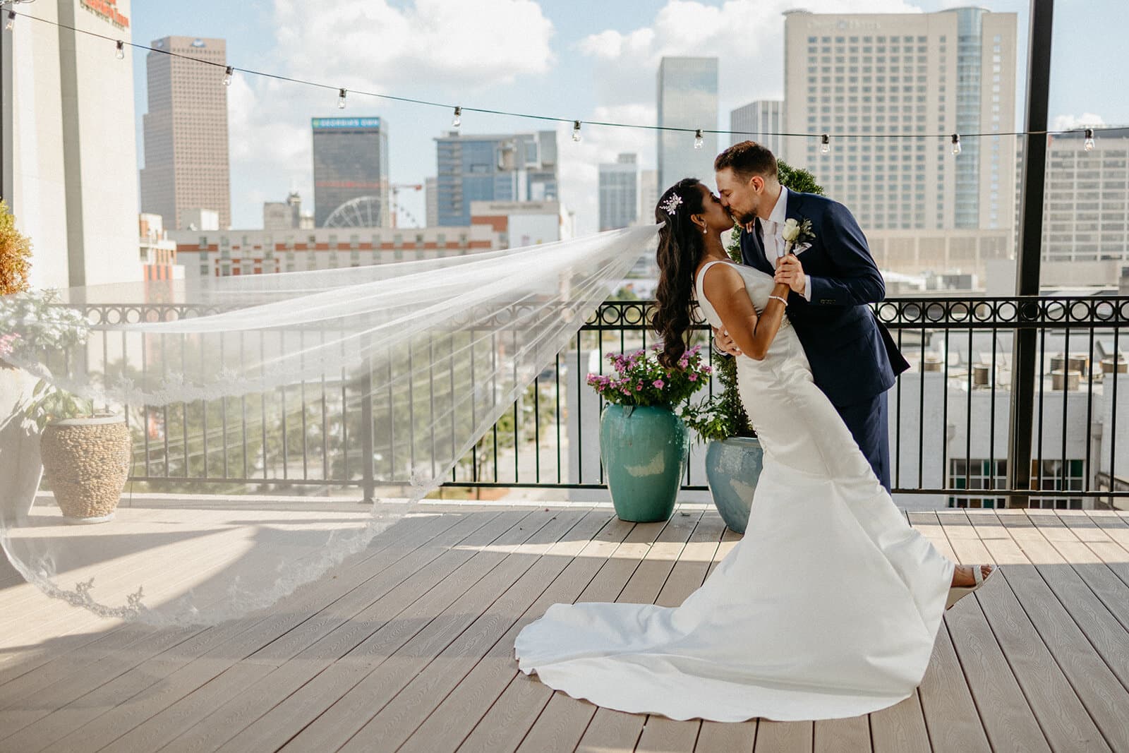 Epic kiss between bride and groom on the Rooftop Terrace