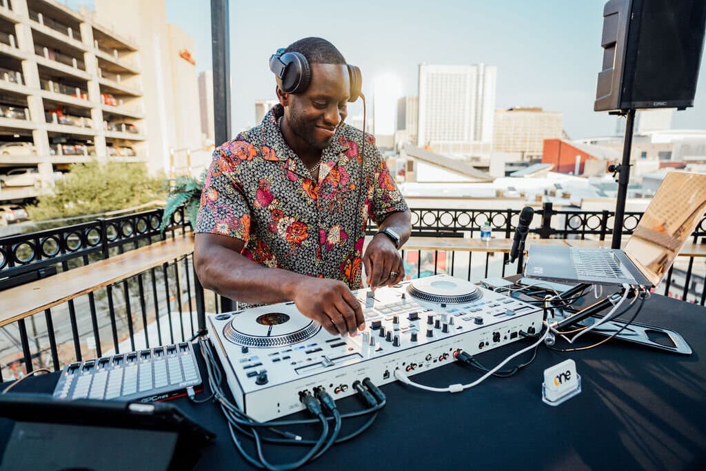 DJ having fun playing music on the rooftop