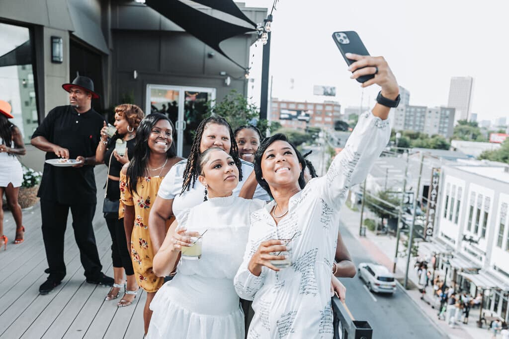 Group of girls taking selfie on the rooftop