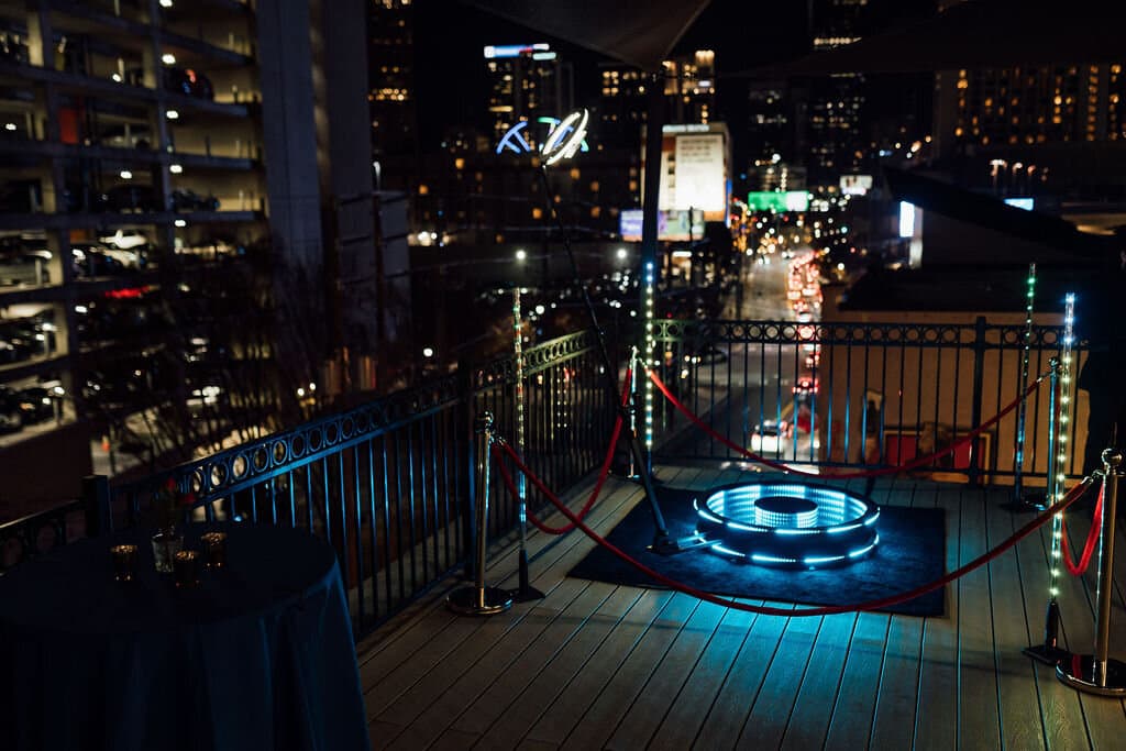 Neon podium on rooftop at night